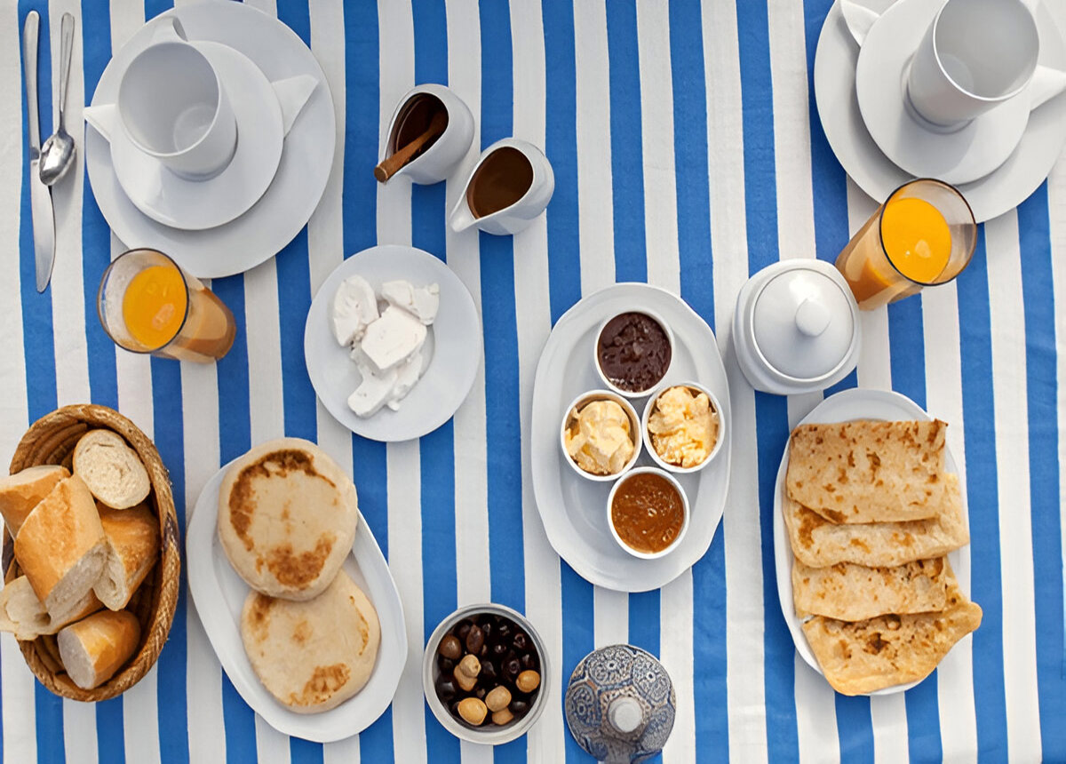 Traditional desert breakfast during 2-Day Desert Adventure Zagora with tea, bread, and local treats