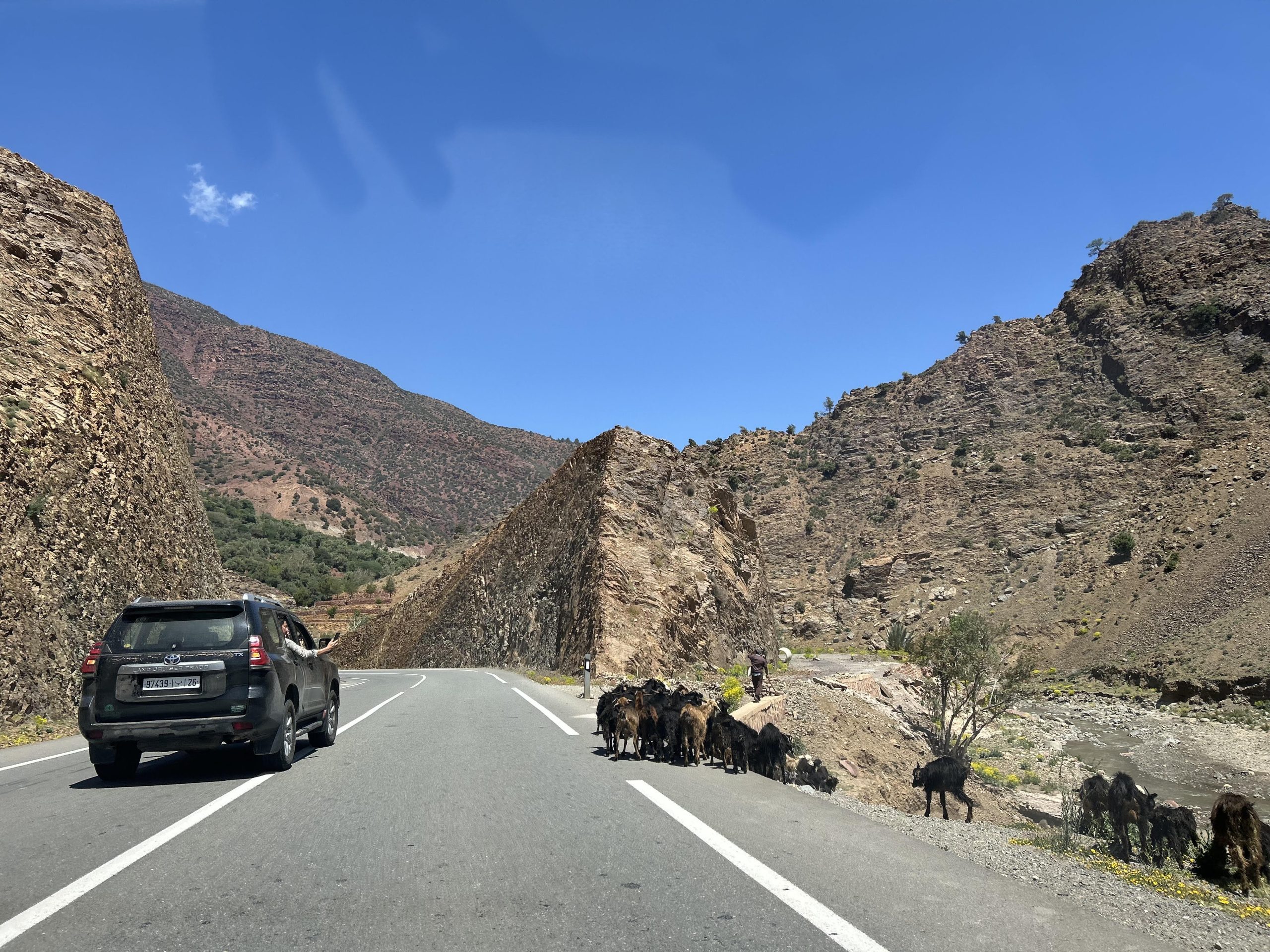Private 4x4 vehicle driving through the High Atlas Mountains on a desert tour from Rabat Morocco