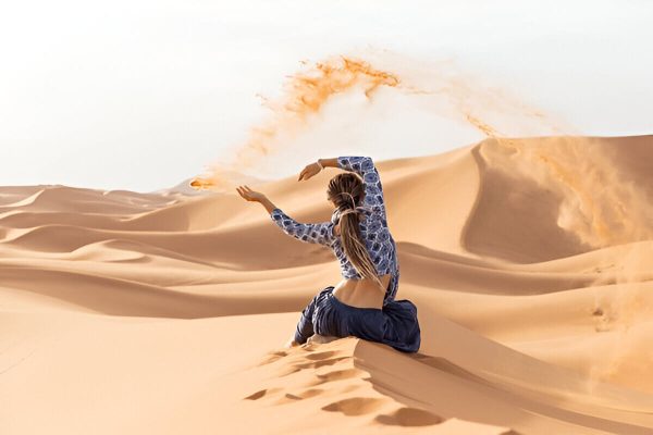 Travelers enjoying the spectacular dunes of the Sahara during a private desert tour from Marrakech.