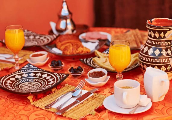 Guests enjoying breakfast at a luxury desert camp in the Sahara Desert near Merzouga