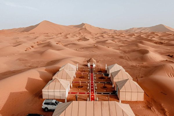Luxury desert camp surrounded by the Erg Chigaga dunes on a 3-day Marrakech desert tour