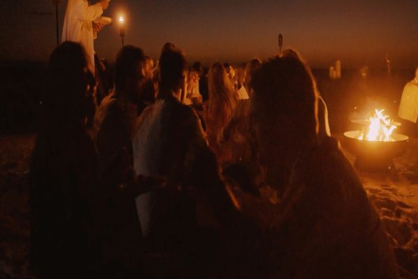 Group enjoying traditional music around a campfire in the Merzouga Sahara