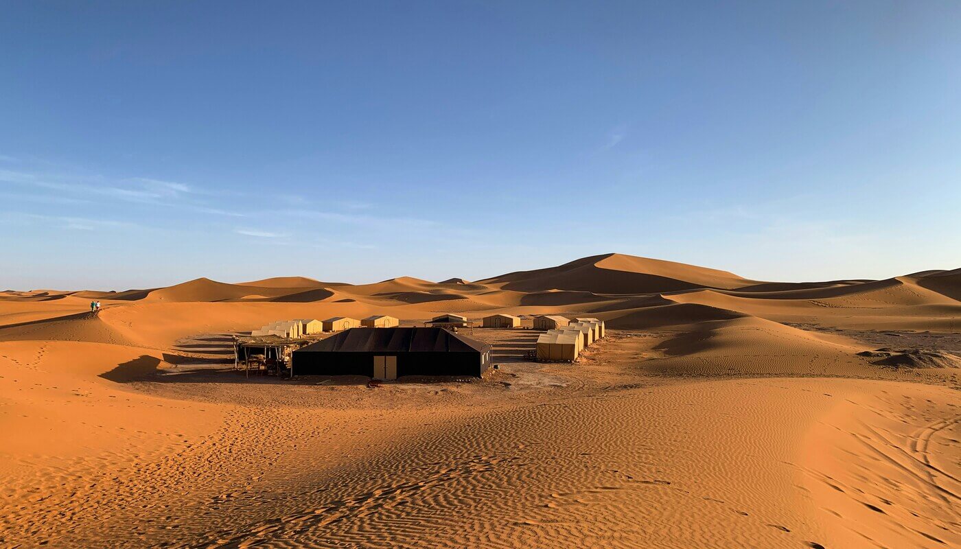 Luxury desert tent among the golden dunes of Erg Lihoudi, Morocco